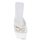 Chic white slider sandals for women with gold detailing, perfect for summer styles
