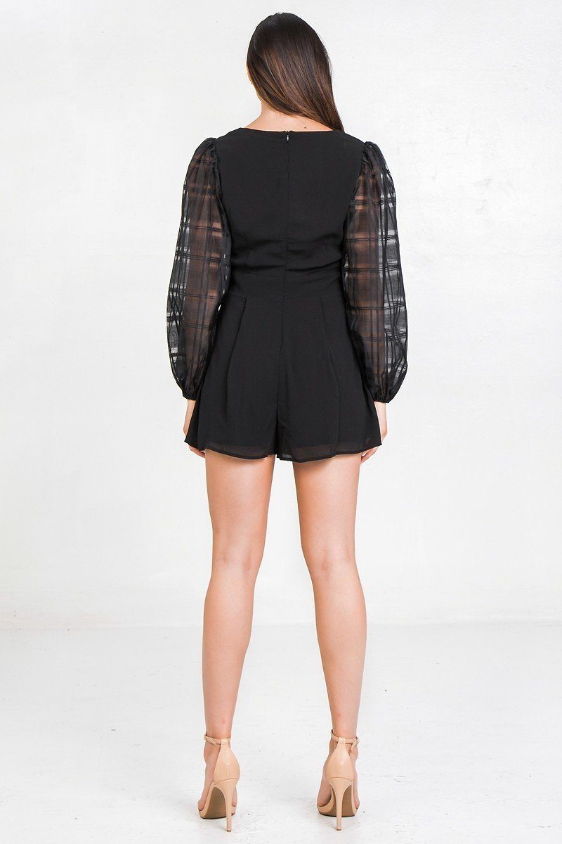 Stylish black solid short romper with sheer puff sleeves for a chic summer look