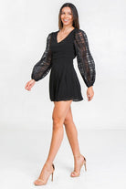 Stylish black solid short romper with puff sleeves, perfect for summer outings and casual wear