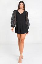 Stylish black solid short romper with puff sleeves for a trendy summer look