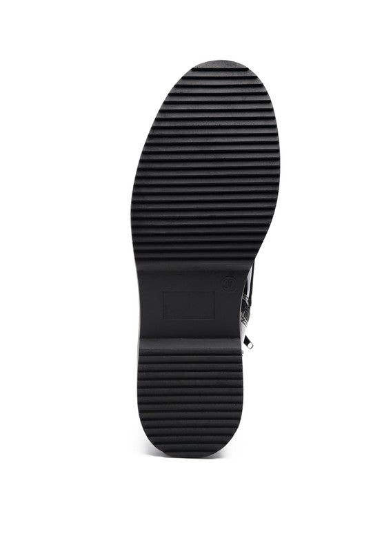 Sole of black statement combat boots by Rag Company with durable traction for comfort and style