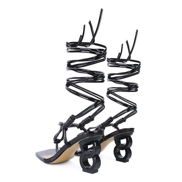 Rag Company black strappy vacation sandals with unique spiral straps and sculpted heels