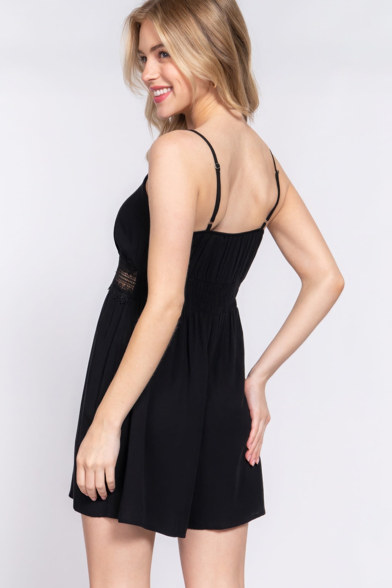 Black summer romper for women with a fitted waist and adjustable straps, perfect for warm weather outings
