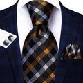 Men's designer tie in black and gold for formal black tie wedding guest dress