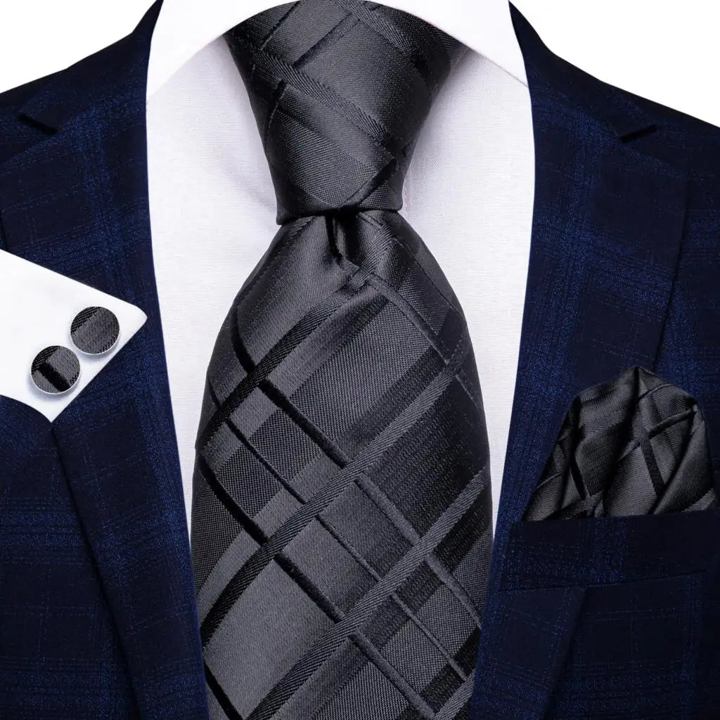 Men's navy suit with black tie, perfect for weddings