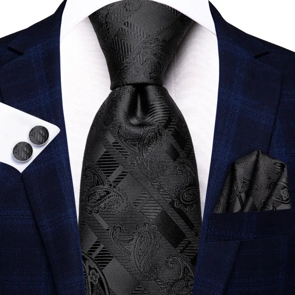 Men's black tie wedding guest dress attire with elegant tie and pocket square