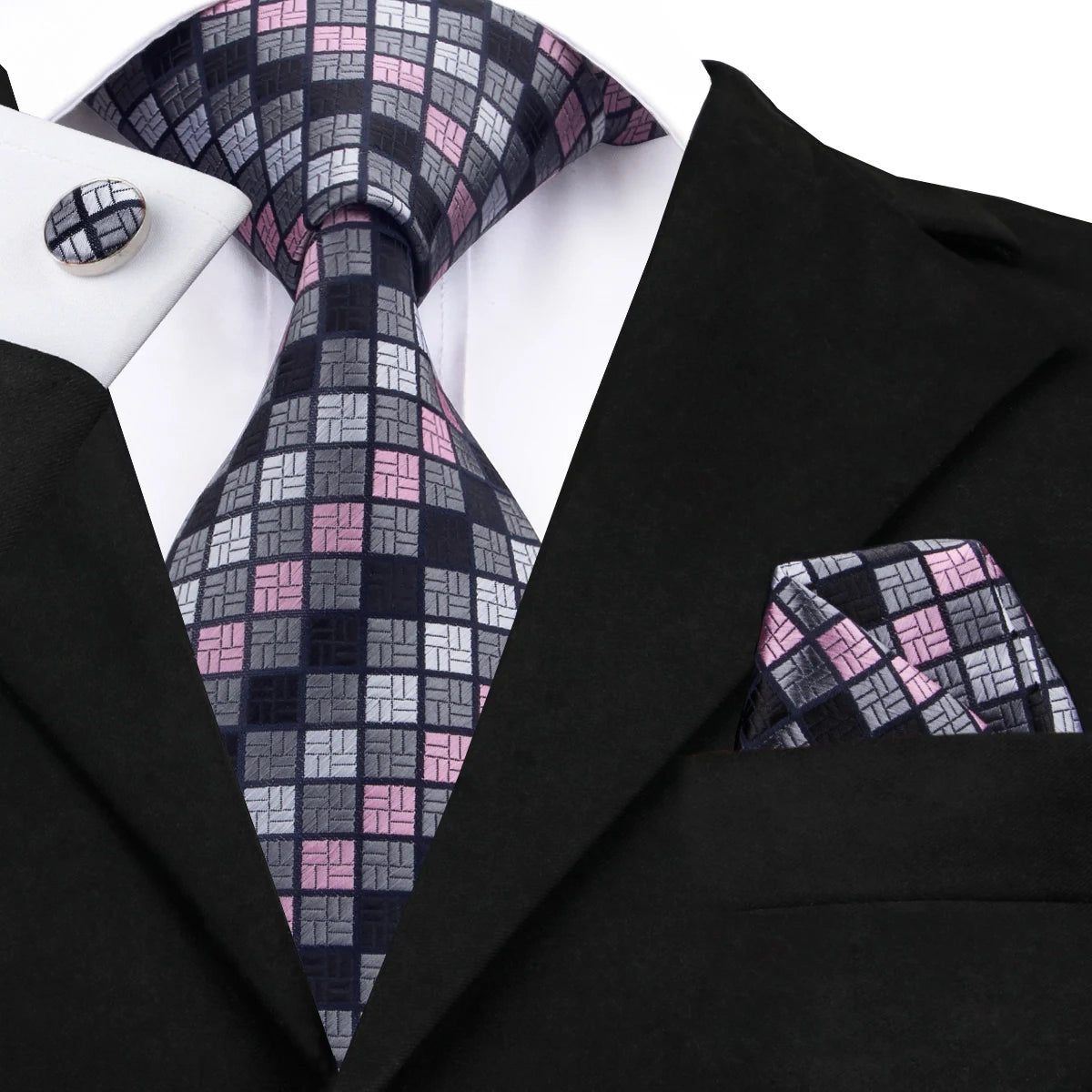 Men's black tie wedding guest dress with patterned tie and pocket square