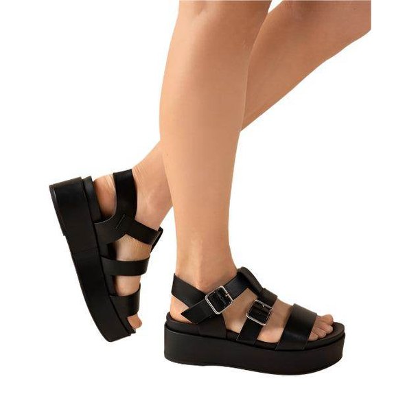 Fortune Dynamic black vacation sandals featuring a platform design with adjustable straps