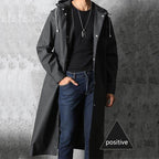 Black waterproof raincoat for adults, ideal for travel and outdoor use