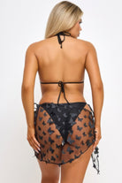 Back view of the VacationGrabs blossom bikini set featuring a black design and butterfly details