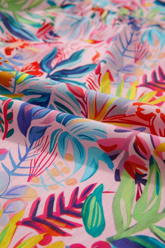 Women's floral blouse in vibrant colors, perfect for summer outings