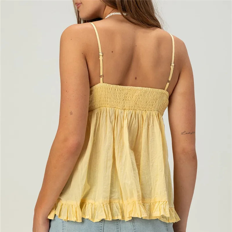 Women's yellow flowy blouse perfect for casual summer outings