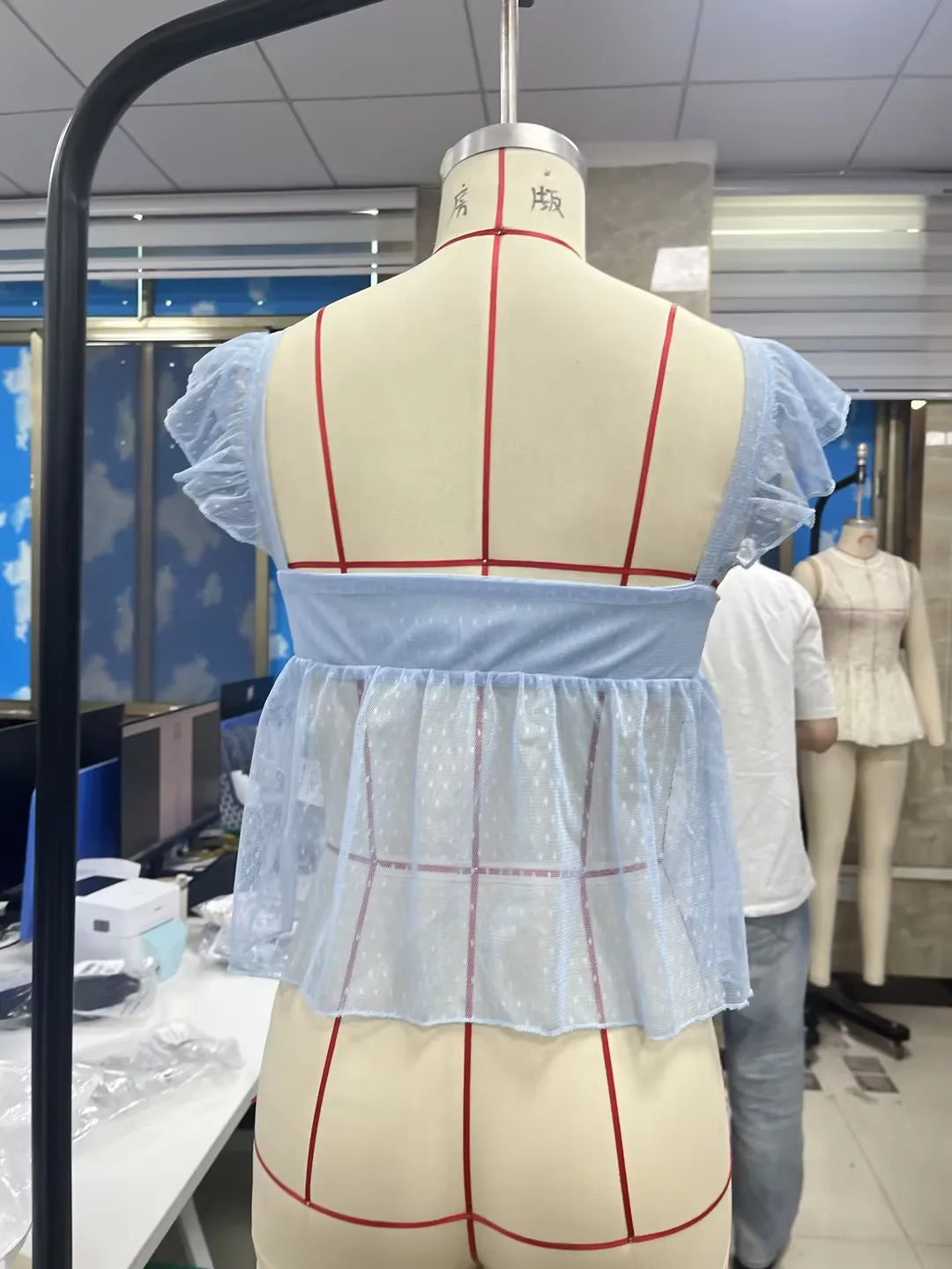 Light blue blouse peplum with sheer back, stylish for summer outings