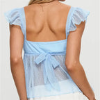 women's blue peplum blouse with sheer fabric and bow detail