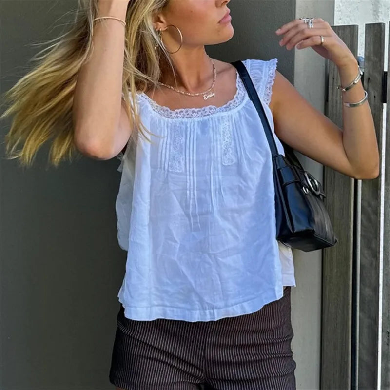 White vintage blouse with lace detailing, perfect for casual outings