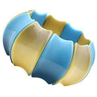 Colorful blue and yellow synthetic bracelet with a unique wavy design from VacationGrabs