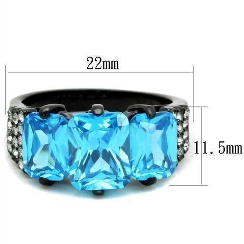 Elegant blue gemstone cocktail ring with three rectangular stones and a sleek black band