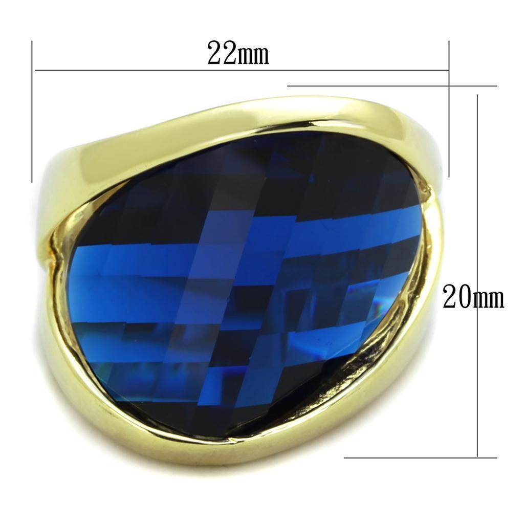 Blue gemstone gold ring for women featuring a large faceted blue stone set in a sleek gold band