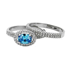 Elegant blue gemstone sterling silver ring for women with sparkling details and an oval centerpiece