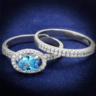 Blue gemstone sterling silver ring for women featuring an oval cut stone and sparkling accent stones