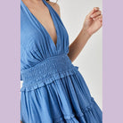 Mustard Seed blue halter neck smocked dress with deep neckline and tiered ruffle skirt