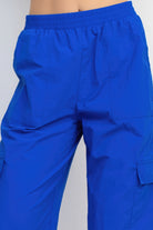 Women's blue high-rise cargo parachute pants with elastic waistband by VacationGrabs