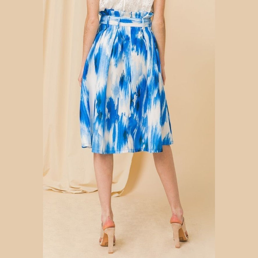Blue midi vacation skirt by VacationGrabs with abstract pattern and belted waist detail