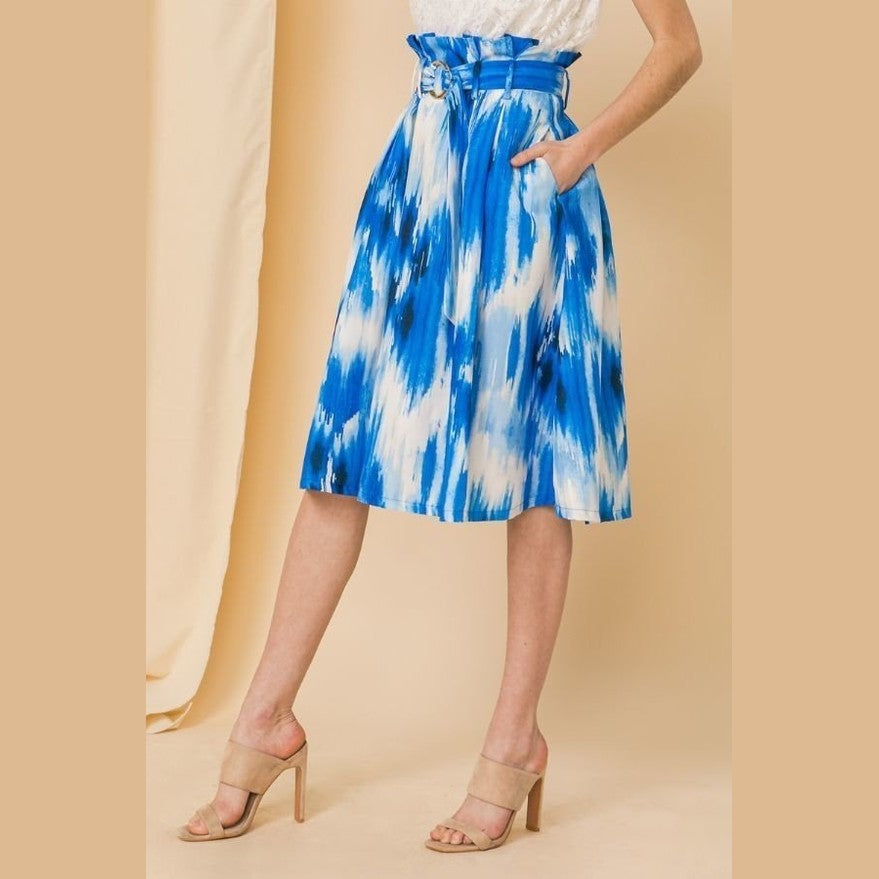 VacationGrabs blue midi vacation skirt with white pattern and paperbag waist worn with beige heels