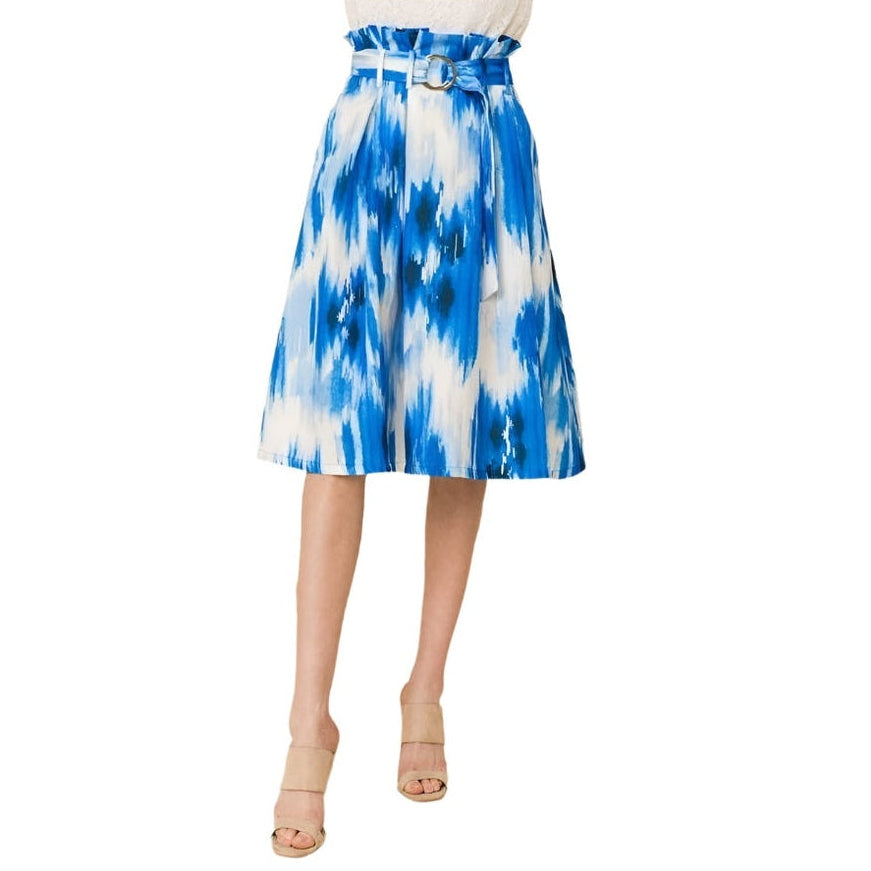 VacationGrabs blue midi vacation skirt with belt and abstract pattern on model wearing neutral heels