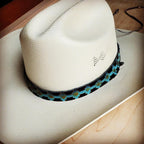 Stylish blue Navajo leather hat band on a cowboy hat for a unique western look