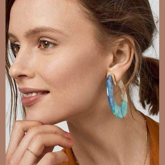 ClaudiaG Collection blue resin hoop earrings showcased on a model for a stylish look