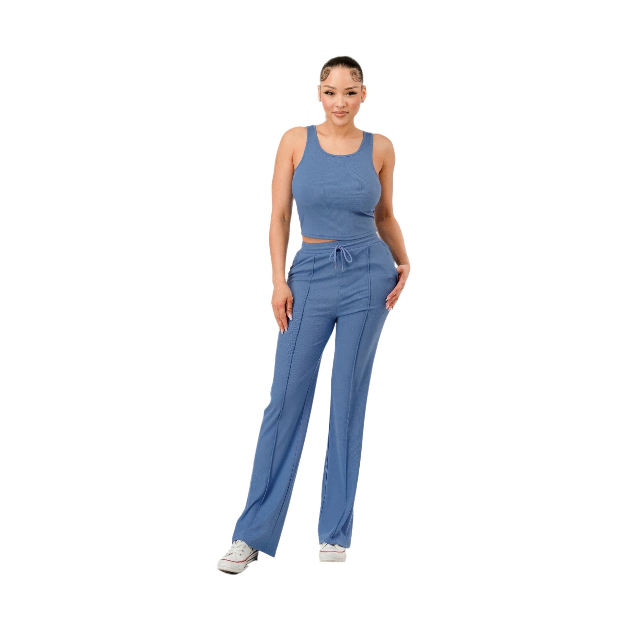 Woman wearing blue ribbed matching set with tank top and drawstring pants by VacationGrabs