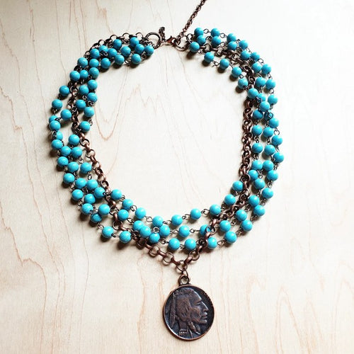 Blue turquoise coin necklace featuring multiple strands and a vintage coin pendant