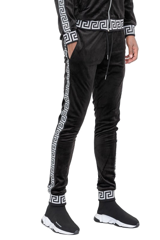 Black velour jogger pants with white geometric side stripes and cuffs by WEIV