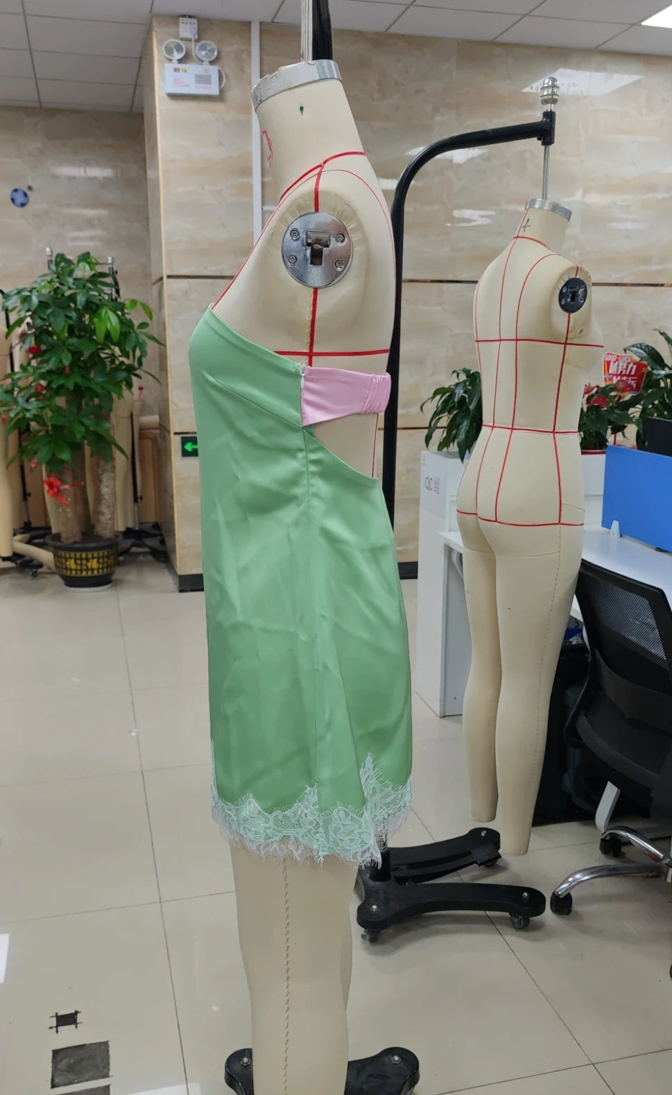 Women's green and pink bodycon dress with lace detailing, stylish summer wear