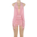 Pink vacation cover-up layered over a bodycon dress