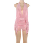 Pink vacation cover-up layered over a bodycon dress