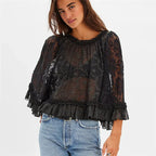 Women's black boho blouse with sheer lace, perfect for casual outings