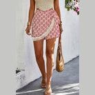 VacationGrabs boho fringe shorts for women with red geometric pattern and cream tassel trim