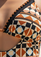 Close-up of VacationGrabs boho geometric print monokini featuring vibrant colors and unique patterns