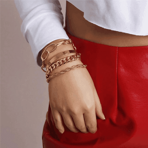 Stylish boho gold charm bracelets stacked on a woman's wrist, perfect for adding a trendy touch