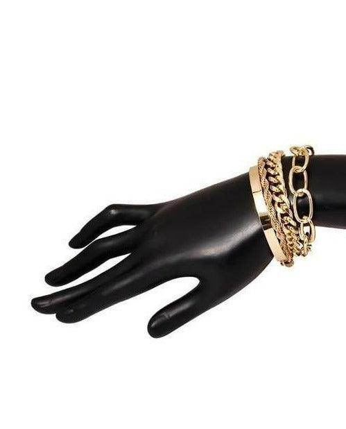 Stylish boho gold charm bracelets displayed on a black hand model for trendy jewelry lovers
