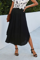 VacationGrabs women's black boho print flowy skirt styled with tie-dye top and black heels