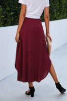VacationGrabs women's boho print flowy skirt in deep red worn with white top and black heels