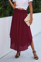 VacationGrabs women's boho print flowy skirt in burgundy paired with white top and black sandals
