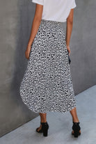 VacationGrabs women's boho print flowy skirt with black and white leopard pattern paired with a white top