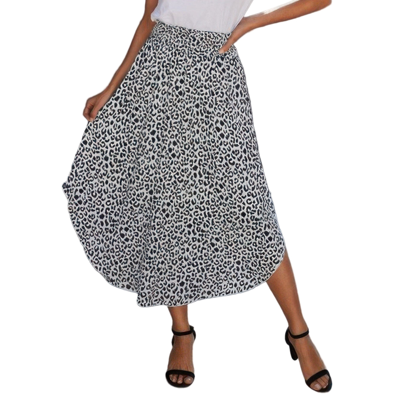 Woman wearing a VacationGrabs boho print flowy skirt paired with a white t-shirt and black sandals
