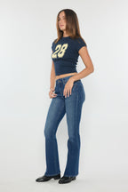 Women's blue bootcut jeans with boots for a stylish look