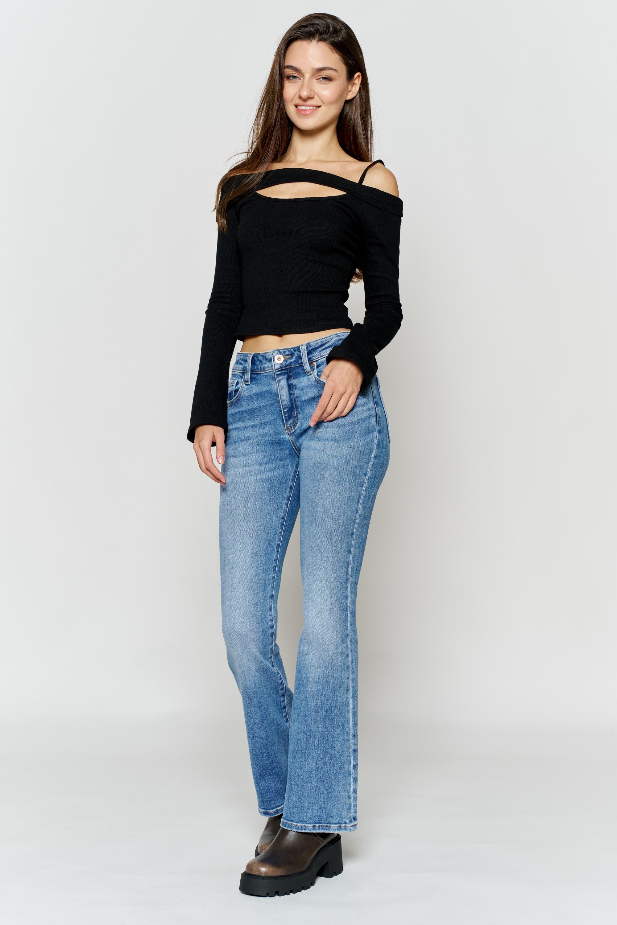 Women's bootcut jeans in light blue, perfect for pairing with boots