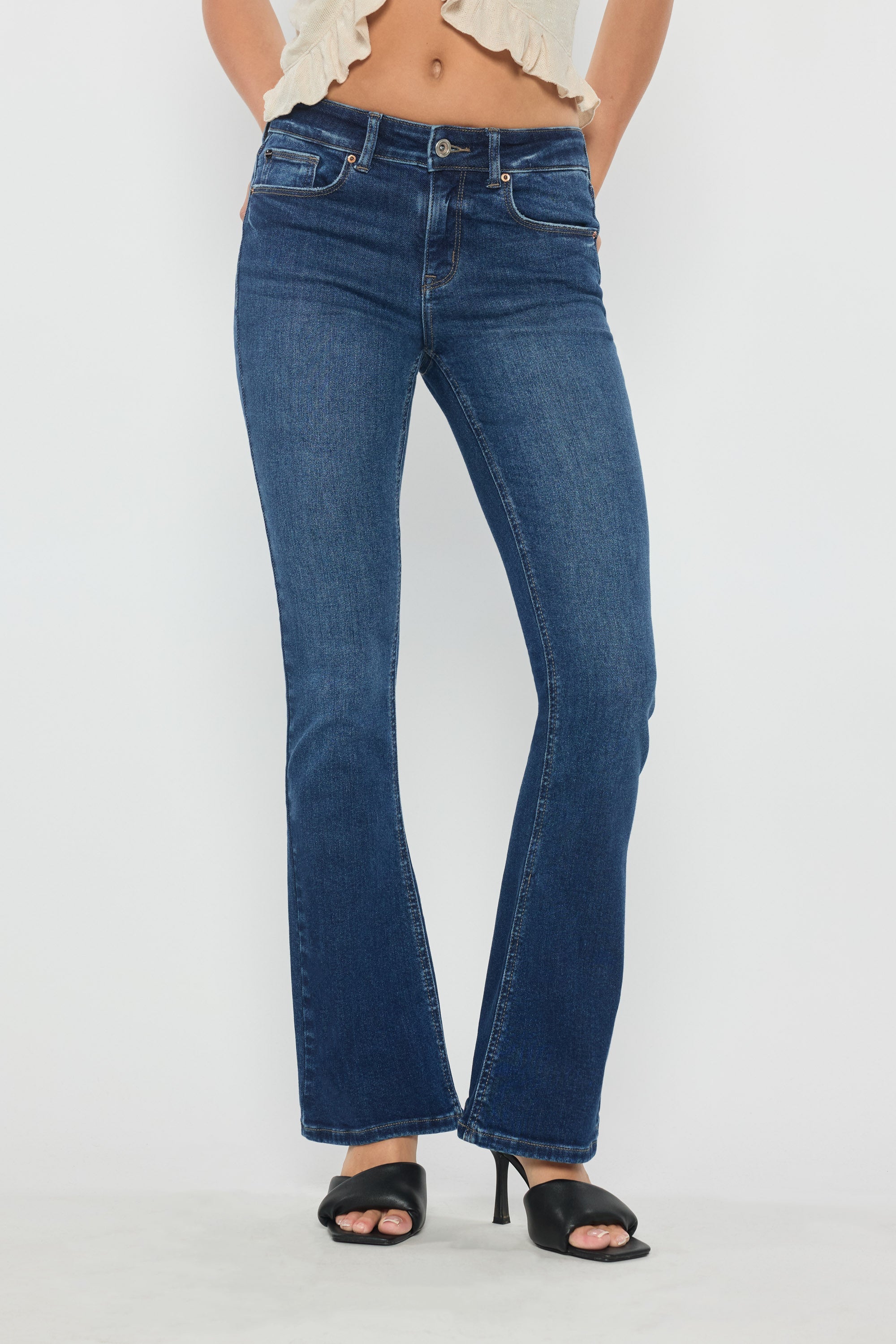 Women's bootcut jeans in dark blue denim, perfect for wearing with boots